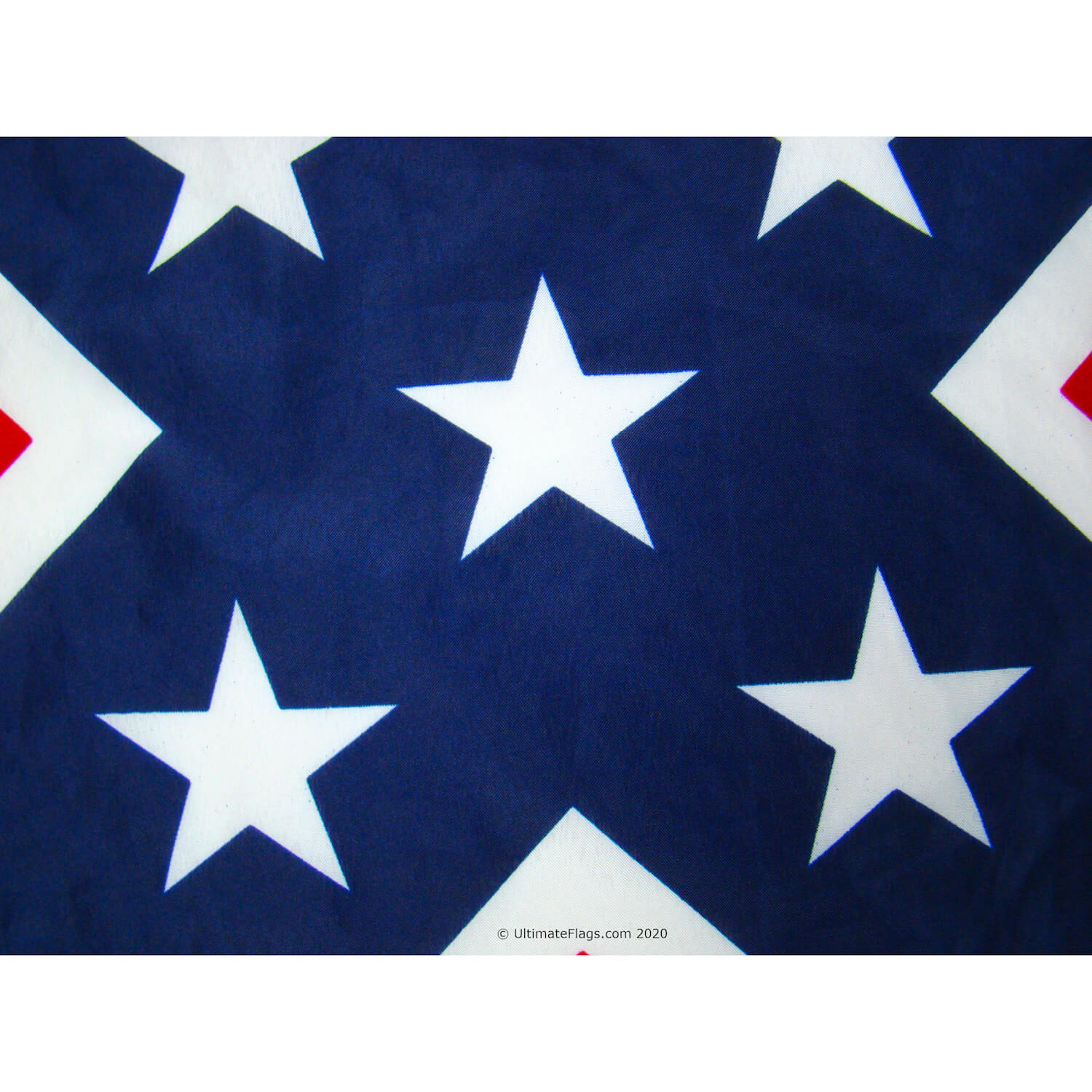 closeup of printed stars on old ms flag
