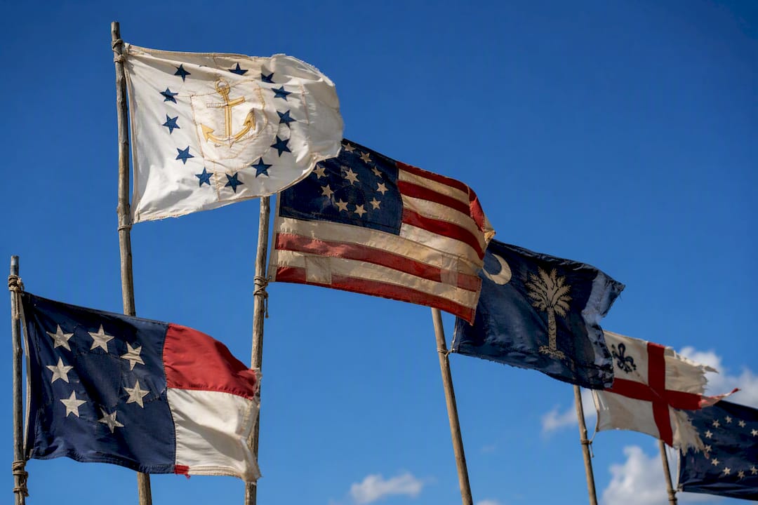 Multiple variants of Revolutionary War flags flying