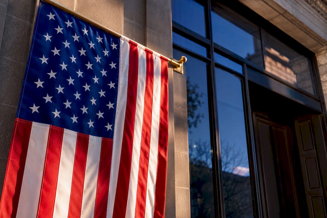 Partial U.S. flag union at upper left