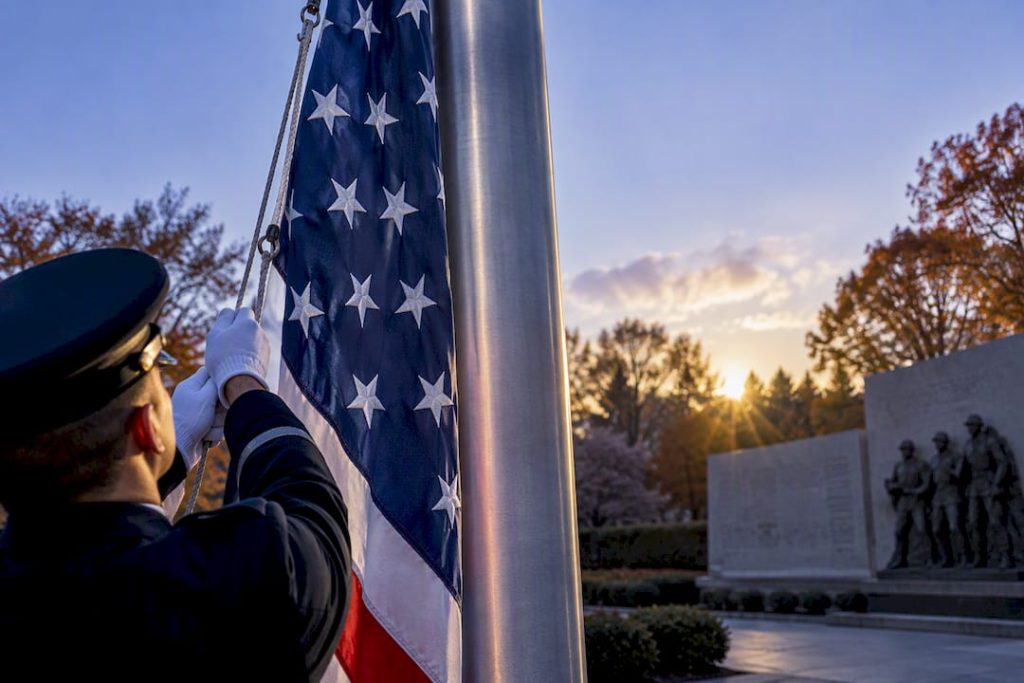 Cropped flag raised at a veterans memorial
