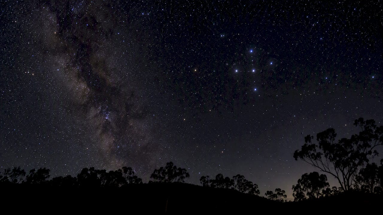 Southern Cross constellation above Australian landscape